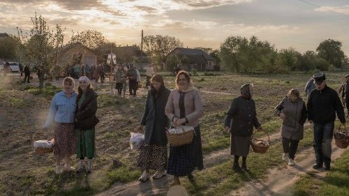 Orthodox believers carry traditional Easter baskets in the village of Krasne, Ukraine