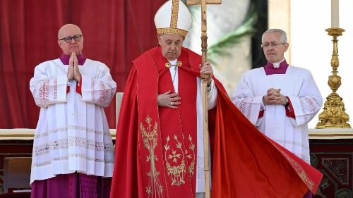 Pope Francis prays at Palm Sunday Mass in St. Peter's Square